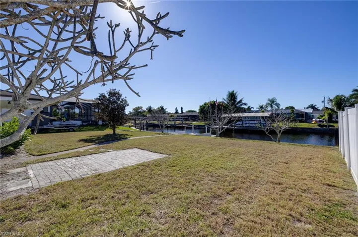 View of grassy yard featuring a water view