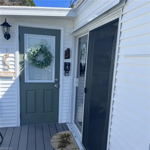 Property entrance featuring a deck