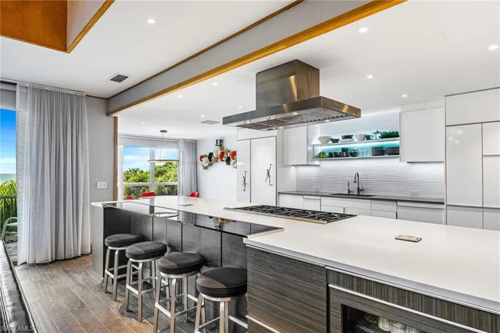 Kitchen with cooking center and breakfast bar