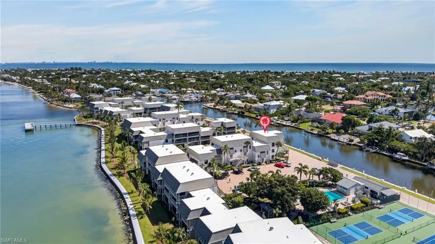 Coastal community with direct water access, tennis courts, and a community pool