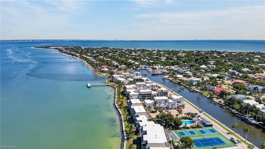 Waterfront property with direct Gulf access, community tennis courts, and an outdoor pool