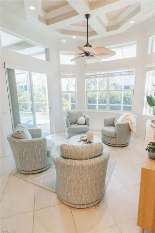 Sunroom/second living room area with beamed and coffered ceiling