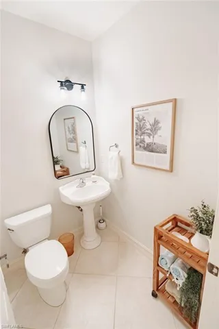 Half bath in hallway between 2 guest bedrooms