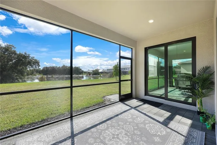 Unfurnished sunroom with a water view