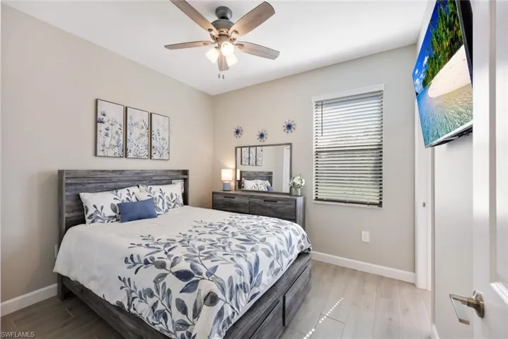 Bedroom with light wood-type flooring and ceiling fan