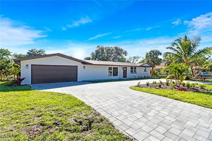Ranch-style house with u shaped driveway