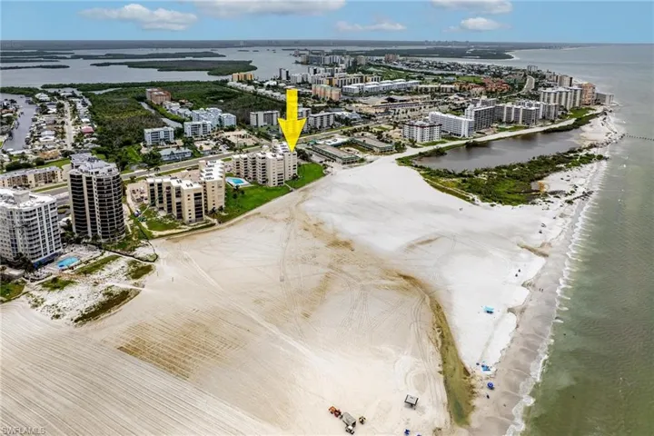 Bird's eye view with a water view and a beach view