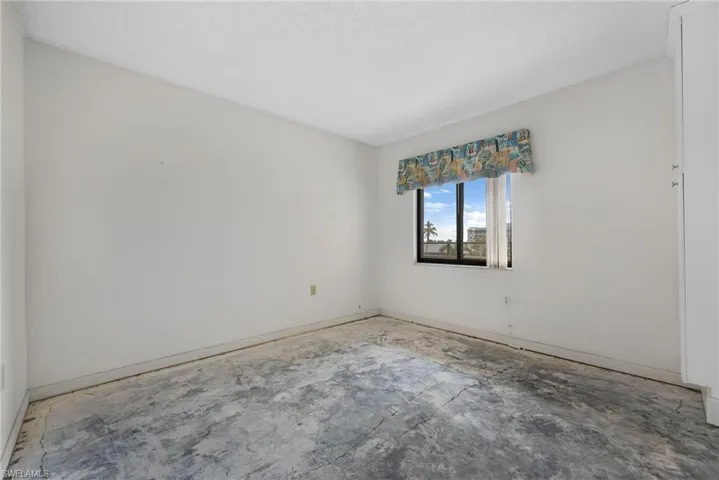 Unfurnished room with a textured ceiling