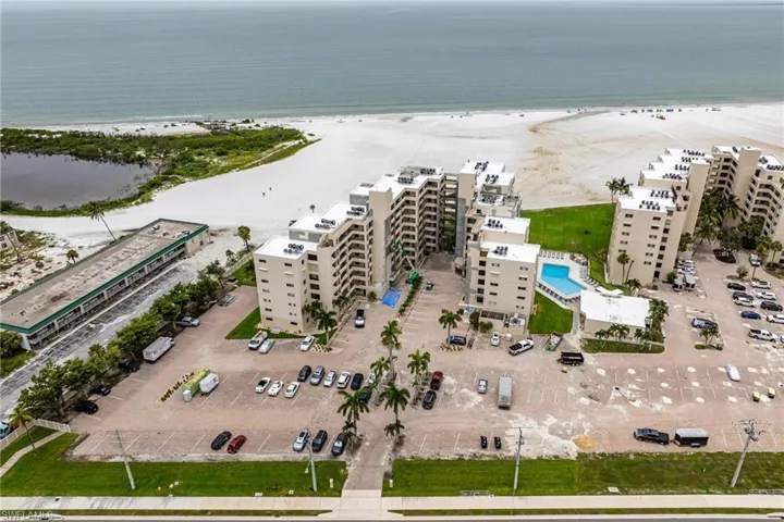 Bird's eye view with a water view and a beach view