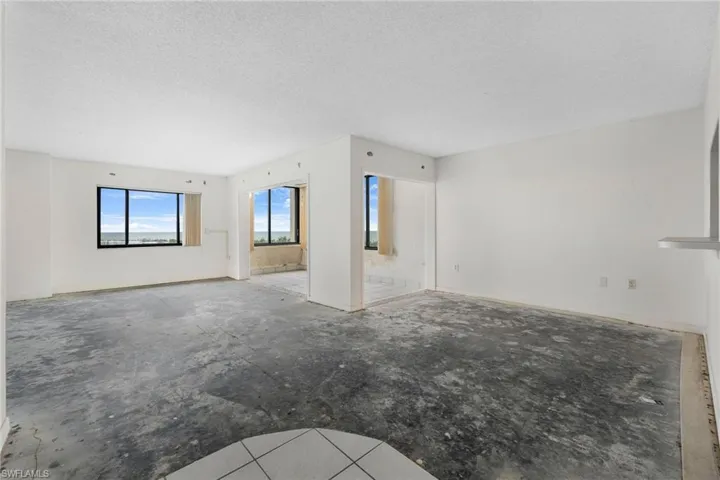 Unfurnished living room with a textured ceiling