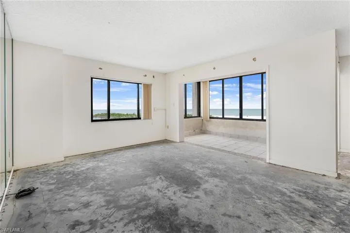 Unfurnished room featuring a textured ceiling