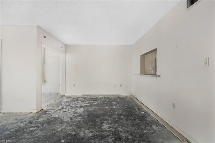 Empty room featuring a textured ceiling