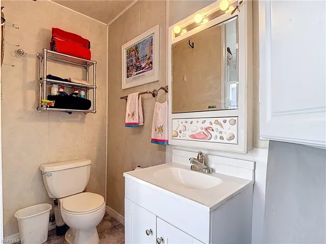 Bathroom featuring vanity and toilet