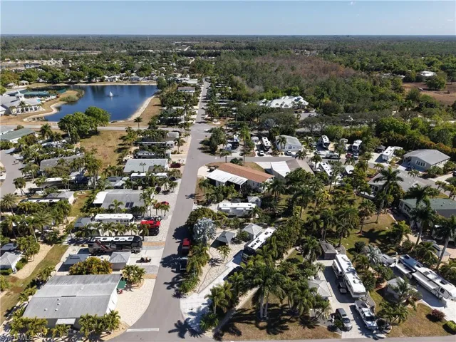 Aerial view of property's location featuring nearby suburban area and a large body of water
