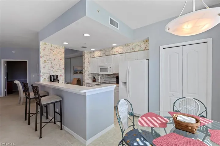 Kitchen featuring Breakfast bar, Breakfast nook and pantry