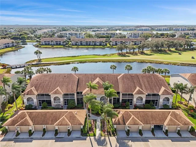Aerial view of front of condo as well as lake and golf course