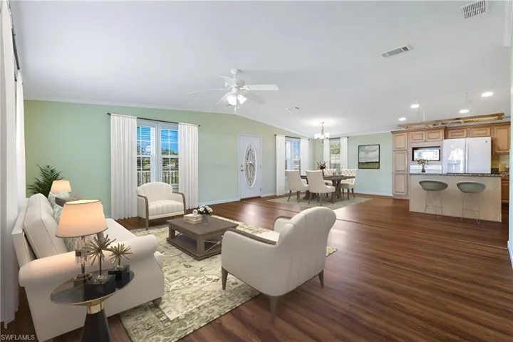 Virtually Staged - Open Floor plan with wood laminate flooring