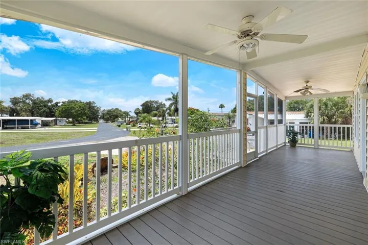 30' long Front Screened Patio with Composite Wood Flooring.