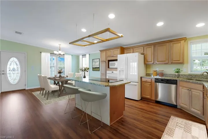 Virtually Staged, Kitchen with white appliances and Center Island.