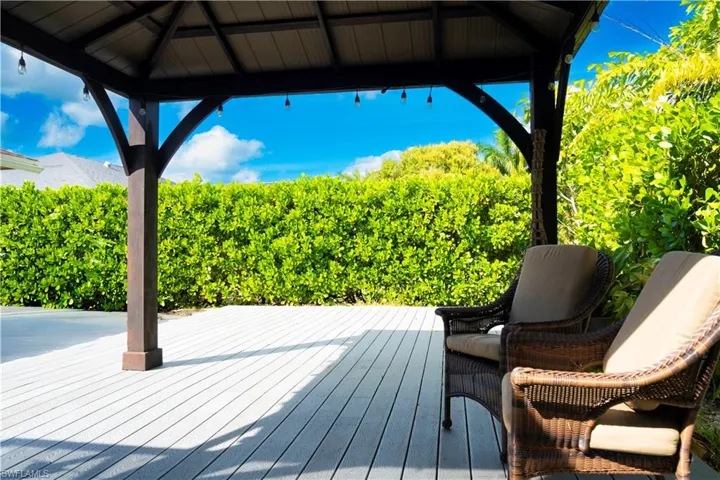 Wooden deck featuring a gazebo