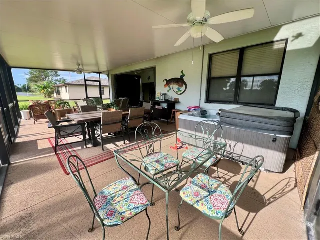 Sunroom / solarium featuring ceiling fan