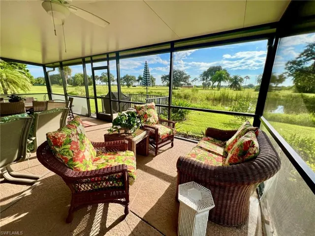 Sunroom / solarium featuring ceiling fan