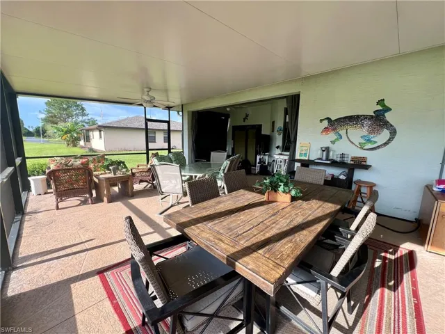 Sunroom featuring ceiling fan
