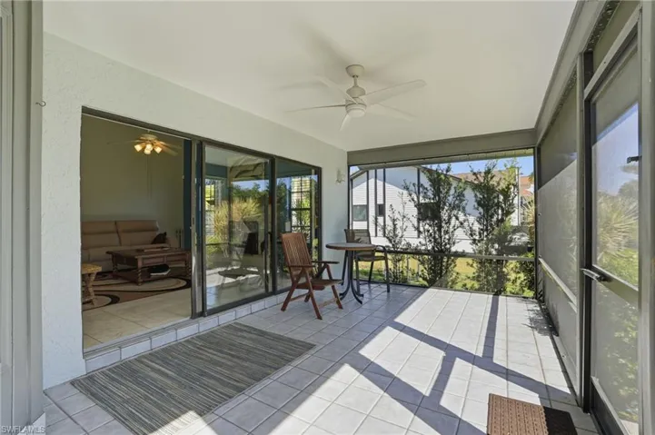 Sunroom / solarium featuring ceiling fan