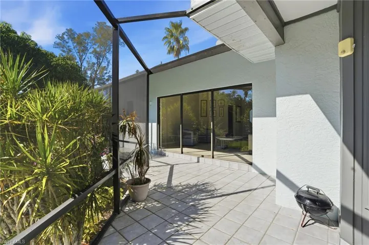 View of patio / terrace featuring a sunroom and a lanai