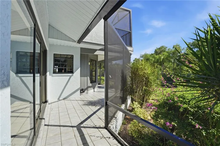 Balcony featuring a sunroom
