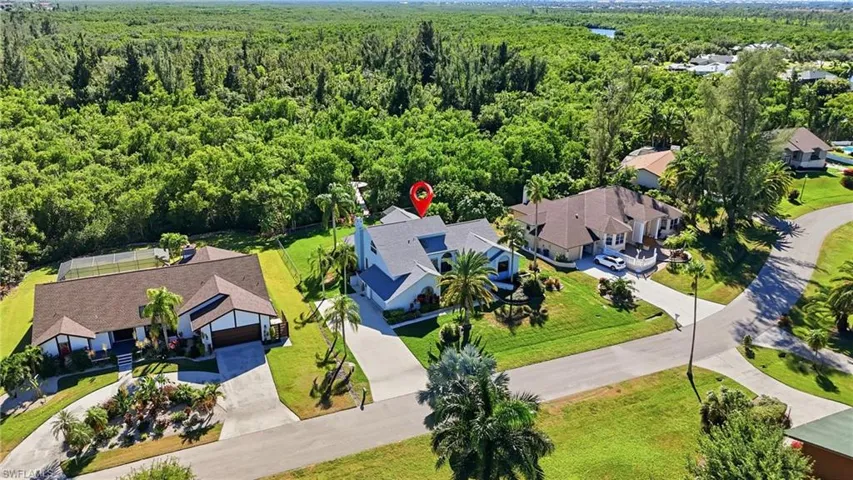Aerial view of residential area with a forest