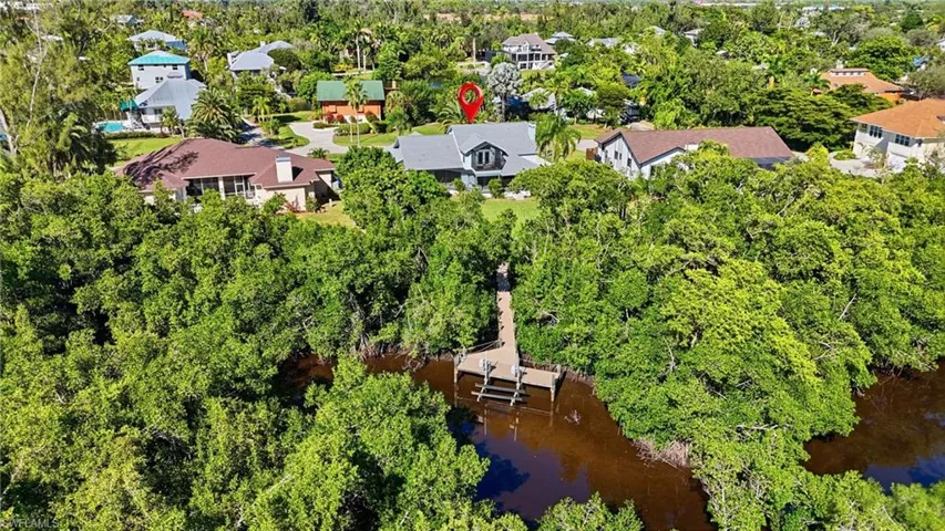 Aerial view of residential area with a tree filled landscape