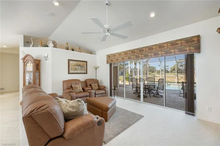 Living Room with view to pool and lake