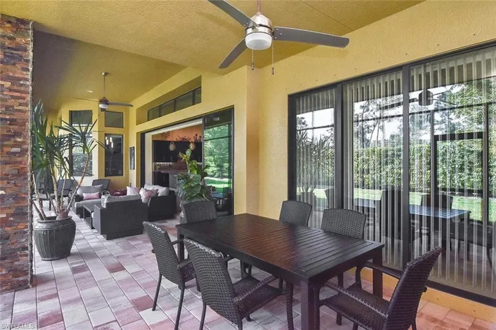 View of patio / terrace with an outdoor living space, outdoor dining area, and a ceiling fan