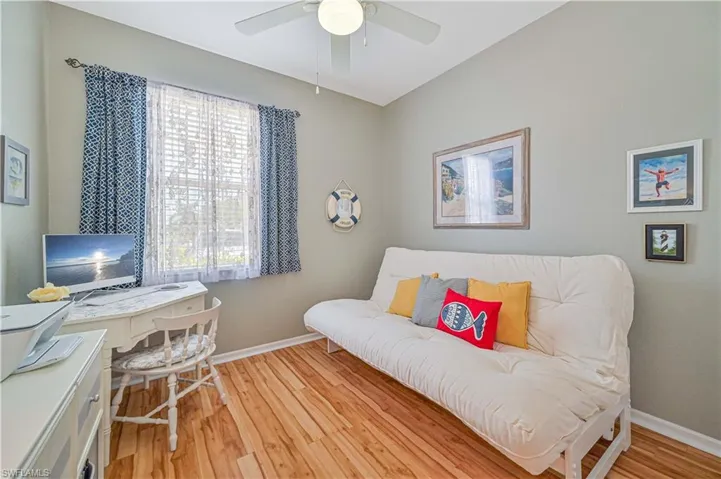 Office with ceiling fan and light wood-type flooring