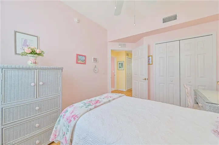 Bedroom featuring a closet, ceiling fan, and hardwood / wood-style floors