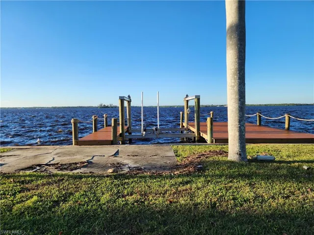 Dock area featuring a water view