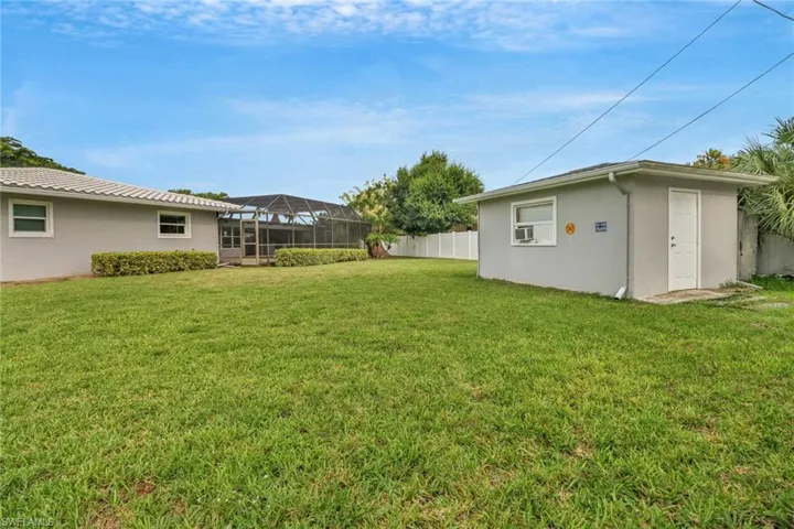 View of yard featuring a lanai
