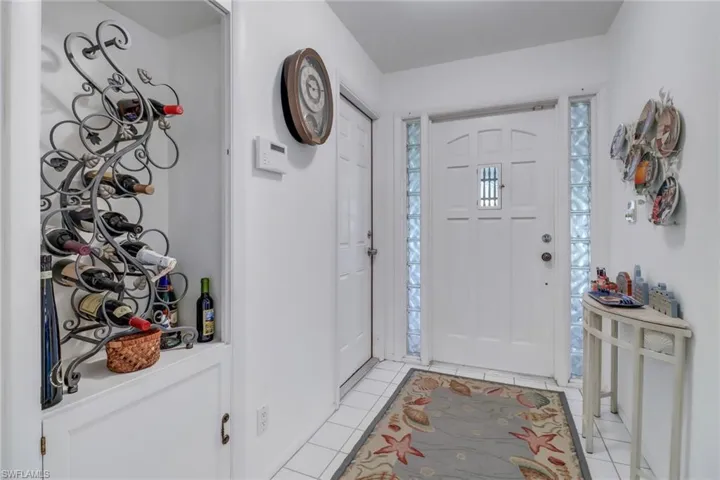 Foyer featuring light tile patterned floors