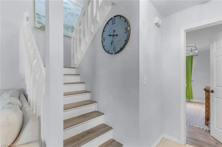Stairway with wood-type flooring leading to the Master Retreat.