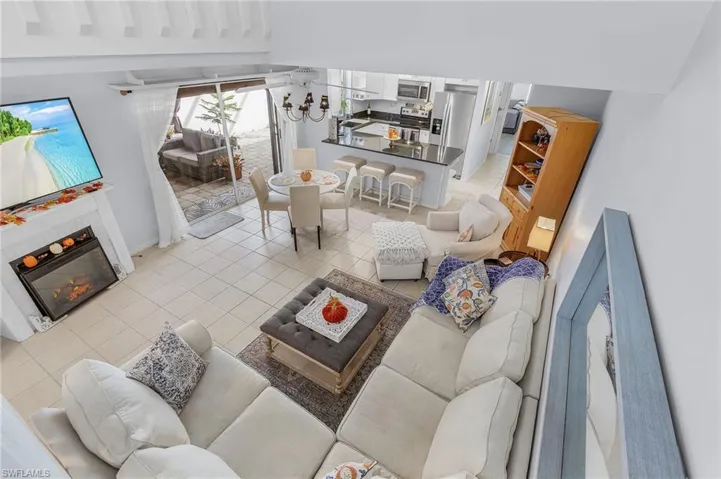 Tiled living room featuring sink