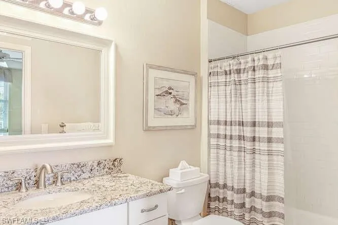 Full bath with vanity and shower / bathtub combination with curtain