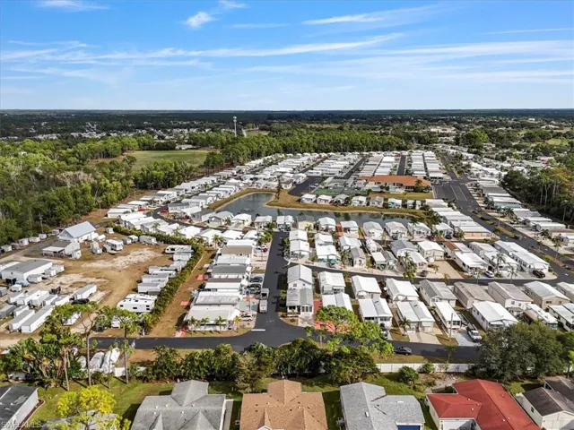 Aerial overview of property's location with nearby suburban area and a large body of water