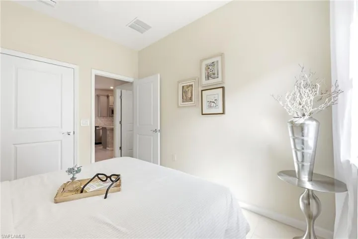Neutral painted walls with white trim and a white paneled door