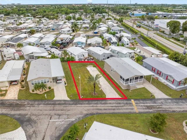 Aerial view of residential area featuring property boundaries highlighted