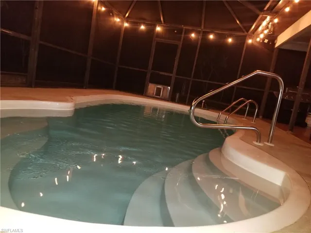 View of swimming pool featuring a jacuzzi