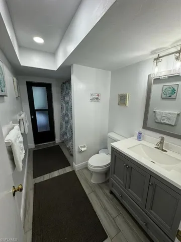 Bathroom featuring oversized vanity and toilet