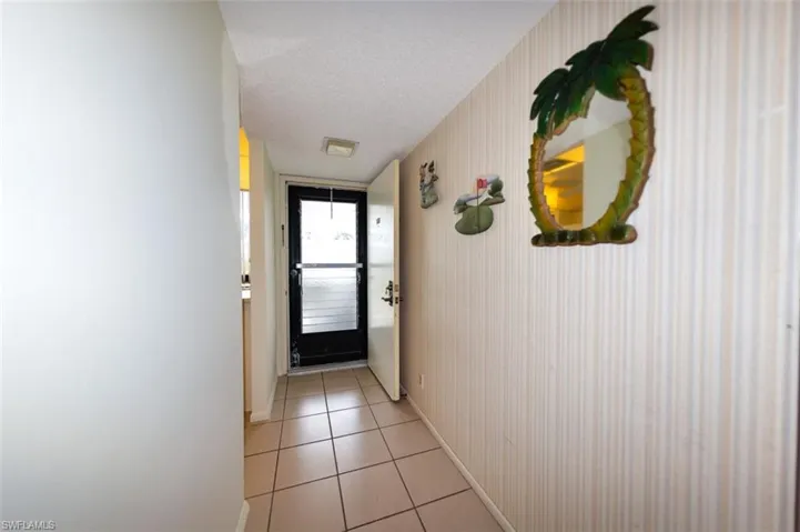 UNIT ENTRANCE.  KITCHEN ENTRANCE SHOWN AT LEFT.