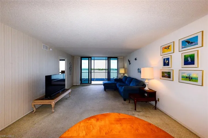 LIVING AREA SHOWING ENTRANCE TO OWNER'S SUITE