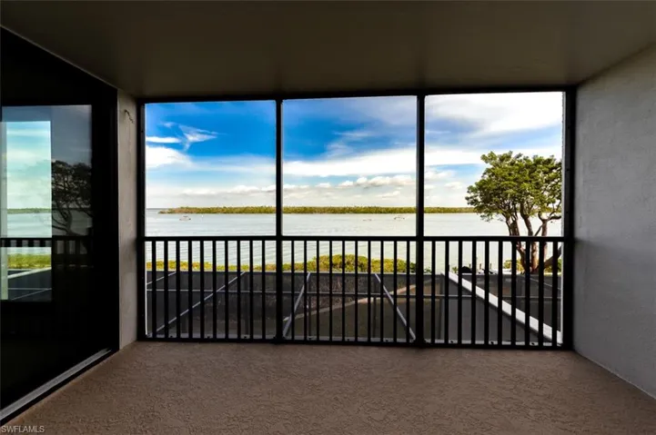 FULL ESTERO BAY VIEWS FROM NEWLY REDONE LANAI.  ENTRANCE TO OWNER'S SUITE IS TO LEFT.